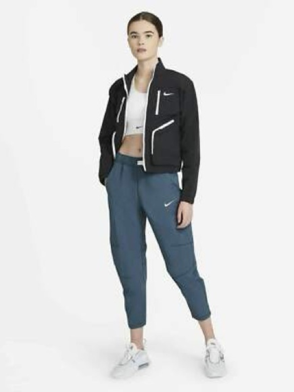 Nike Women's Sportswear Tech Pack Woven Pants in Blue.